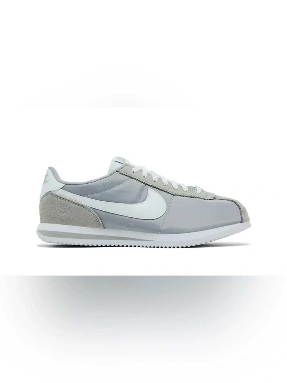 Woman’s gray Nike Cortez basic nylon